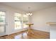 Bright dining area with hardwood floors, chandelier, and natural light at 25 Ruth Cir, Fuquay Varina, NC 27526