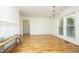 Dining area features wood floors, wainscoting, chandelier, and large window at 25 Ruth Cir, Fuquay Varina, NC 27526