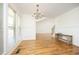 Elegant dining room with wainscoting, hardwood floors, and a chandelier at 25 Ruth Cir, Fuquay Varina, NC 27526