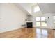 Cozy living room featuring a fireplace, hardwood floors, and recessed lighting at 25 Ruth Cir, Fuquay Varina, NC 27526