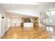 Expansive open-concept living area with hardwood floors, a kitchen, and abundant natural light at 25 Ruth Cir, Fuquay Varina, NC 27526