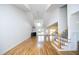 Open living room with hardwood floors, high ceilings, and a cozy fireplace at 25 Ruth Cir, Fuquay Varina, NC 27526
