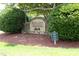 Community entrance sign for Ballard Woods Est. 2002 with lush greenery at 25 Ruth Cir, Fuquay Varina, NC 27526