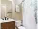 Stylish bathroom featuring a marble vanity, framed mirror and shower with decorative leaf shower curtain at 3021 Lawson Walk Way, Rolesville, NC 27571