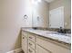 Bathroom with granite countertops, double sinks and white cabinets at 3021 Lawson Walk Way, Rolesville, NC 27571