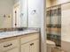 Bathroom with granite countertops, white cabinets, and a shower-tub combo at 3021 Lawson Walk Way, Rolesville, NC 27571