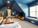 Charming bonus room with a sloped ceiling, window seat, and modern entertainment center at 3021 Lawson Walk Way, Rolesville, NC 27571