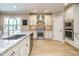 Spacious kitchen with white cabinets, stainless steel appliances, and granite countertops at 3021 Lawson Walk Way, Rolesville, NC 27571