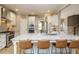 Spacious kitchen island with granite countertop and bar seating at 3021 Lawson Walk Way, Rolesville, NC 27571