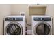 Laundry room with a side-by-side washer and dryer, and upper cabinets at 3021 Lawson Walk Way, Rolesville, NC 27571