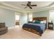 Tranquil main bedroom with natural light, tray ceilings, en-suite bathroom with a soaking tub at 3021 Lawson Walk Way, Rolesville, NC 27571