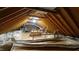 Spacious attic featuring exposed beams, ample insulation, and plenty of storage space at 304 Ramblewood Dr, Raleigh, NC 27609