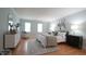 Spacious bedroom features windows, wood floors, and neutral paint at 304 Ramblewood Dr, Raleigh, NC 27609