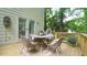 Wooden deck featuring outdoor seating, a peaceful atmosphere, and a view of the wooded surroundings at 304 Ramblewood Dr, Raleigh, NC 27609