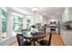Eat-in kitchen features a cozy dining area and natural light from a bay window at 304 Ramblewood Dr, Raleigh, NC 27609