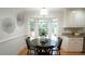 Eat-in kitchen features a cozy dining area and natural light from a bay window at 304 Ramblewood Dr, Raleigh, NC 27609
