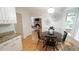 Eat-in kitchen features a cozy dining area and a view to the brick fireplace at 304 Ramblewood Dr, Raleigh, NC 27609