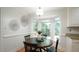 Cozy breakfast nook features hardwood floors and bay window at 304 Ramblewood Dr, Raleigh, NC 27609