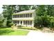 Charming two-story home boasts classic design with black shutters and lush landscaping at 304 Ramblewood Dr, Raleigh, NC 27609