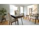 Well-lit home office featuring hardwood floors, elegant furniture, and serene atmosphere at 304 Ramblewood Dr, Raleigh, NC 27609