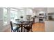 Bright kitchen with modern appliances and dining area with breakfast nook at 304 Ramblewood Dr, Raleigh, NC 27609