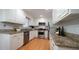 Well-maintained kitchen with granite countertops and stainless steel appliances at 304 Ramblewood Dr, Raleigh, NC 27609