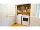 Laundry room features washer, dryer and storage shelves at 304 Ramblewood Dr, Raleigh, NC 27609