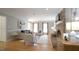 Charming living room featuring a brick fireplace, hardwood floors, and neutral furnishings at 304 Ramblewood Dr, Raleigh, NC 27609