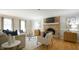 Cozy living room with a brick fireplace, hardwood floors, and stylish furnishings at 304 Ramblewood Dr, Raleigh, NC 27609