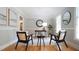 Cozy home office area with a wood desk, stylish chairs and plenty of natural light at 304 Ramblewood Dr, Raleigh, NC 27609