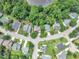 Aerial view of a neighborhood with mature trees and well-kept lawns at 3101 Sawyers Mill Dr, Apex, NC 27539