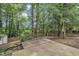 Spacious backyard with trees and a partial concrete patio at 3101 Sawyers Mill Dr, Apex, NC 27539