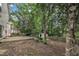 Spacious backyard with trees and a partial concrete patio and storage shed at 3101 Sawyers Mill Dr, Apex, NC 27539