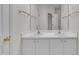 Bright bathroom featuring a double sink vanity and a large mirror at 3101 Sawyers Mill Dr, Apex, NC 27539