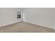 Simple bedroom featuring neutral walls and carpet, with a bright window at 3101 Sawyers Mill Dr, Apex, NC 27539