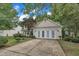 Two-story home showcasing a three car garage and landscaped front yard at 3101 Sawyers Mill Dr, Apex, NC 27539