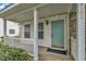 Inviting front porch with a teal door and stone accents at 3101 Sawyers Mill Dr, Apex, NC 27539