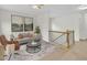 Cozy living room with neutral tones, stylish decor, and adjacent staircase at 3101 Sawyers Mill Dr, Apex, NC 27539