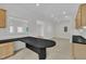 Open-concept living space featuring a custom wet bar and cozy carpeting at 3101 Sawyers Mill Dr, Apex, NC 27539