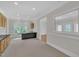 Spacious living room with carpet, recessed lighting, and a built-in wet bar at 3101 Sawyers Mill Dr, Apex, NC 27539