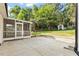 Backyard view of a screened porch, patio, and storage shed at 3129 Merrianne Dr, Raleigh, NC 27607