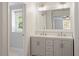 Bathroom featuring double vanity with granite counters and modern fixtures at 3129 Merrianne Dr, Raleigh, NC 27607