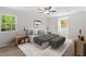 Bedroom with windows, hardwood floors, and modern furnishings at 3129 Merrianne Dr, Raleigh, NC 27607