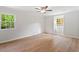 Bedroom featuring wood floors, neutral paint, double-paned windows, and a ceiling fan at 3129 Merrianne Dr, Raleigh, NC 27607