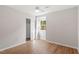 Bright bedroom with a ceiling fan, wood-look floors, closet, and a window at 3129 Merrianne Dr, Raleigh, NC 27607