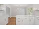 This kitchen features white cabinets, a dining area, and lots of counter space at 3129 Merrianne Dr, Raleigh, NC 27607