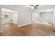 Spacious living room with wood floors, open to the kitchen, offering a modern design at 3129 Merrianne Dr, Raleigh, NC 27607