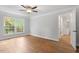 Bright and airy living room with hardwood floors and view into kitchen at 3129 Merrianne Dr, Raleigh, NC 27607
