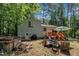 Secluded backyard with deck, hot tub, and lush greenery offering a private outdoor retreat at 320 Bainbridge Cir, Garner, NC 27529