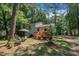 Home exterior with a wooden deck and lots of beautiful trees at 320 Bainbridge Cir, Garner, NC 27529